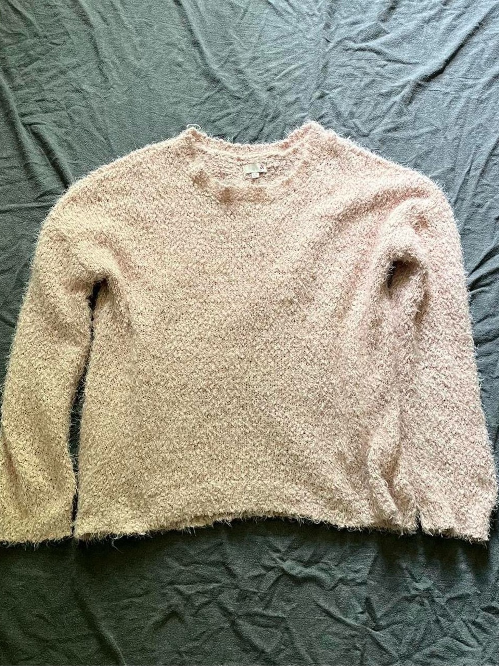 So pink fuzzy sweater